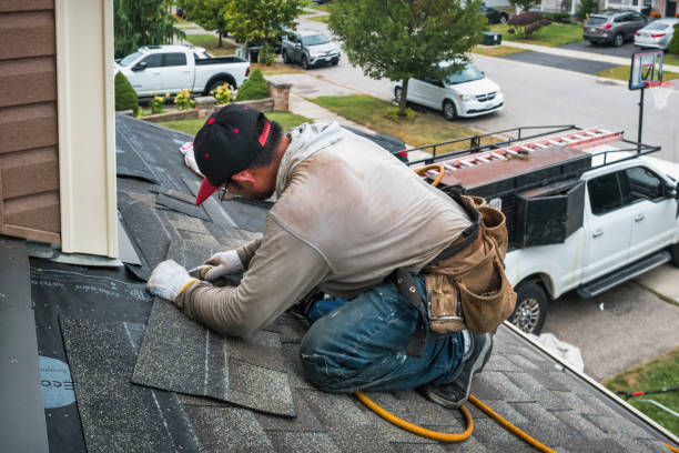 Professional Roofing technician working in Cable, OH